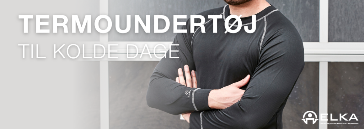 Termoundertj til kolde dage. Person i sort baselayer med korslagte arme. ELKA-logo.
